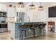 Kitchen island featuring bar stool seating, pendant lighting, granite counters, and stainless appliances at 700 Lorenzo Dr., North Myrtle Beach, SC 29582