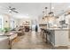 Open concept kitchen and living area highlighting modern fixtures and dining room at 700 Lorenzo Dr., North Myrtle Beach, SC 29582