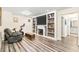 Inviting living room with a fireplace, built-in shelving, and wood-look floors at 700 Lorenzo Dr., North Myrtle Beach, SC 29582