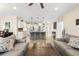 Open floor plan of kitchen and living room, showcasing bar seating and tile flooring at 700 Lorenzo Dr., North Myrtle Beach, SC 29582