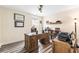 Cozy home office with a wooden desk, built-in bookcase, and natural light at 700 Lorenzo Dr., North Myrtle Beach, SC 29582