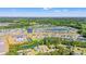 A picturesque aerial view of a lush community with serene lakes, swimming pools, and tennis courts at 7012 Walden Ct., Myrtle Beach, SC 29588