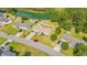 An aerial view of a well-maintained home, featuring a fenced backyard and is located near a picturesque lake at 7012 Walden Ct., Myrtle Beach, SC 29588