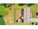 Aerial view of a fenced backyard featuring a patio and storage shed near the serene lakeside property at 7012 Walden Ct., Myrtle Beach, SC 29588