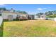Lush green backyard with a patio, storage shed, and a white picket fence at 7012 Walden Ct., Myrtle Beach, SC 29588