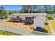 Backyard aerial showcasing a wooden deck, screened in porch and storage shed at 7012 Walden Ct., Myrtle Beach, SC 29588