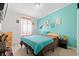bedroom with light carpet, accent wall, window, and playful decor at 7012 Walden Ct., Myrtle Beach, SC 29588
