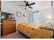 Bedroom with carpet features neutral walls, ceiling fan, and large three-drawer dresser at 7012 Walden Ct., Myrtle Beach, SC 29588