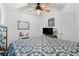 Bedroom with blue and white patterned bedding and ceiling fan at 7012 Walden Ct., Myrtle Beach, SC 29588