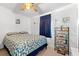 Bedroom with blue and white patterned bedding and blue blackout curtains at 7012 Walden Ct., Myrtle Beach, SC 29588
