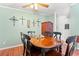 Elegant dining room with a ceiling fan and natural light at 7012 Walden Ct., Myrtle Beach, SC 29588