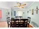 Elegant dining room with a ceiling fan and natural light at 7012 Walden Ct., Myrtle Beach, SC 29588