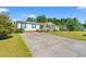 Charming home with a spacious front lawn and a long concrete driveway at 7012 Walden Ct., Myrtle Beach, SC 29588