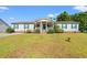 Charming single-story home with a well-manicured lawn and welcoming front porch at 7012 Walden Ct., Myrtle Beach, SC 29588