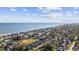 Breathtaking aerial view of a coastal neighborhood with a beach and ocean in the background at 712 Dogwood Dr. S # 101, Surfside Beach, SC 29575