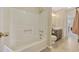 Bathroom featuring a tub and shower combo, tile flooring, and a wood vanity at 712 Dogwood Dr. S # 101, Surfside Beach, SC 29575