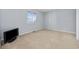 The bedroom has neutral tones, a large window that provides natural light, and carpet flooring at 712 Dogwood Dr. S # 101, Surfside Beach, SC 29575