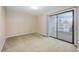 Bedroom with large sliding glass door to the balcony at 712 Dogwood Dr. S # 101, Surfside Beach, SC 29575