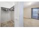 Bright bedroom features closet and sliding glass door access to a porch at 712 Dogwood Dr. S # 101, Surfside Beach, SC 29575