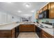 Spacious kitchen featuring wood cabinets and appliances, lots of counterspace, and seamless views of the living space at 712 Dogwood Dr. S # 101, Surfside Beach, SC 29575
