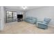 Bright living room features a comfortable sofa and armchair arrangement at 712 Dogwood Dr. S # 101, Surfside Beach, SC 29575