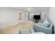 Inviting living room features a sofa, chair and a sliding glass door at 712 Dogwood Dr. S # 101, Surfside Beach, SC 29575