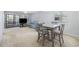 Cozy living room features a couch, sliding doors and dining set at 712 Dogwood Dr. S # 101, Surfside Beach, SC 29575