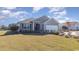 Charming single-story home featuring a well-maintained lawn and an attached garage on a sunny day at 7120 Shooting Star Way, Myrtle Beach, SC 29579