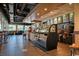 Bright coffee shop featuring a large pastry case and coffee brewing equipment at 7200 N Ocean Blvd. # 436, Myrtle Beach, SC 29572