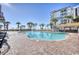 Expansive pool area surrounded by lounge chairs and lush landscaping at 7200 N Ocean Blvd. # 436, Myrtle Beach, SC 29572