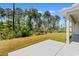 Expansive backyard with lush lawn offers plenty of room for outdoor activities and relaxation at 1421 Crested Iris Way, North Myrtle Beach, SC 29582