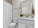 Traditional bathroom featuring vanity, toilet, and shower with tiled surround at 1421 Crested Iris Way, North Myrtle Beach, SC 29582
