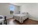 Light and airy bedroom with hardwood floors and a window view at 1421 Crested Iris Way, North Myrtle Beach, SC 29582