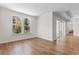Bright bedroom showcases wood floors, a large window, and sliding glass doors to an outdoor area at 1421 Crested Iris Way, North Myrtle Beach, SC 29582