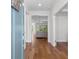 Inviting entryway with hardwood floors and an open view into the living room at 1421 Crested Iris Way, North Myrtle Beach, SC 29582