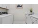 Laundry room featuring washer, dryer, sink, and painting at 1421 Crested Iris Way, North Myrtle Beach, SC 29582