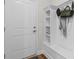 Mudroom featuring coat rack with bench, coat hooks, and storage cubbies at 1421 Crested Iris Way, North Myrtle Beach, SC 29582