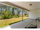 This covered patio provides a comfortable place to relax and enjoy the spacious, tree-lined backyard at 1421 Crested Iris Way, North Myrtle Beach, SC 29582