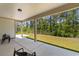 Covered patio provides an outdoor living space with view of the private, wooded backyard at 1421 Crested Iris Way, North Myrtle Beach, SC 29582