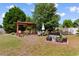 Lush backyard with a charming red gazebo and outdoor seating area at 761 Drawbridge Dr., Conway, SC 29526