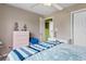 Bright bedroom featuring a ceiling fan, light-colored walls, and desk area at 761 Drawbridge Dr., Conway, SC 29526
