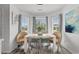 Bright dining area features modern table with seating in front of bay window at 761 Drawbridge Dr., Conway, SC 29526