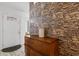 Stylish entryway with a stone wall, modern decor and sleek wood look floors at 761 Drawbridge Dr., Conway, SC 29526