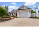 Home exterior with a well manicured lawn, attached garage, and basketball hoop at 761 Drawbridge Dr., Conway, SC 29526