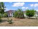 Charming home with red shutters, well-manicured landscaping, and mature trees at 761 Drawbridge Dr., Conway, SC 29526