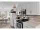 Well lit kitchen with a modern range oven, stainless steel microwave and a kitchen table at 761 Drawbridge Dr., Conway, SC 29526