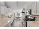 Spacious kitchen with stainless steel appliances, and a white table in the background at 761 Drawbridge Dr., Conway, SC 29526