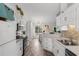 Bright kitchen with white cabinets, stainless steel appliances, and modern backsplash at 761 Drawbridge Dr., Conway, SC 29526