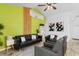 Cozy living room with stylish decor, including a sleek leather sofa and modern wall art at 761 Drawbridge Dr., Conway, SC 29526