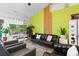 Modern living room with high ceilings, black leather furniture, and light wood flooring at 761 Drawbridge Dr., Conway, SC 29526